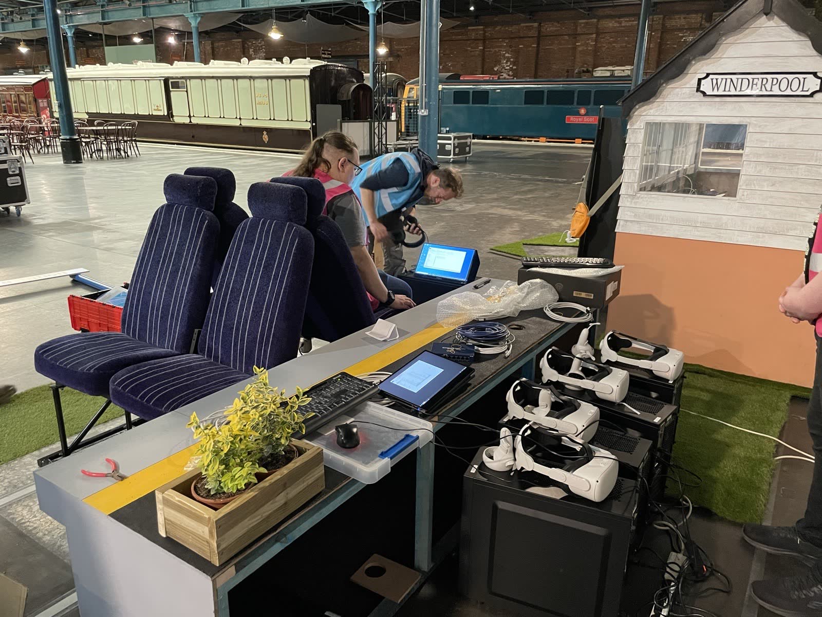 Behind the scenes at the National Railway Museum: VR headsets lined up on the operators&rsquo; desk beside the train seats and signal box