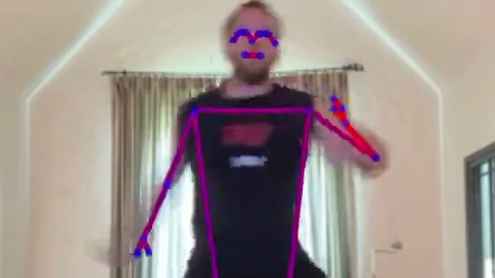 Live machine-learning pose tracking from a single phone camera: a player in their living room with the skeleton drawn over them