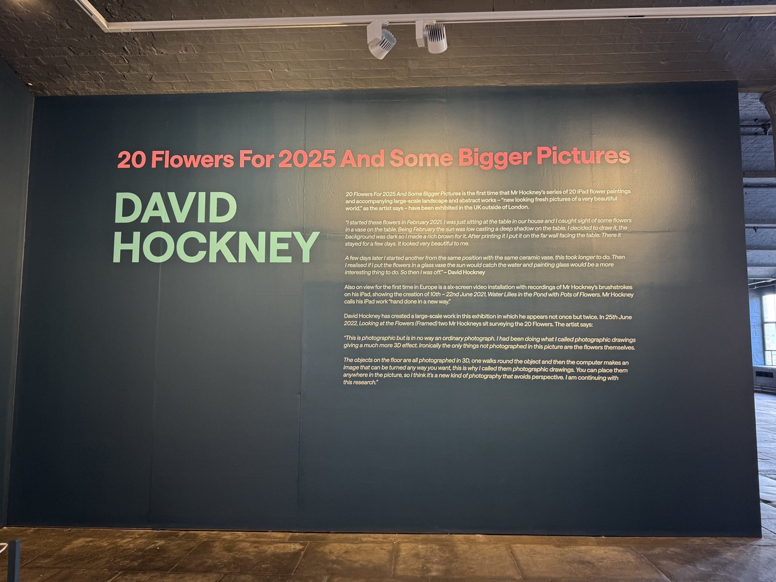 The exhibition's title wall at Salts Mill: 20 Flowers for 2025 and Some Bigger Pictures, David Hockney